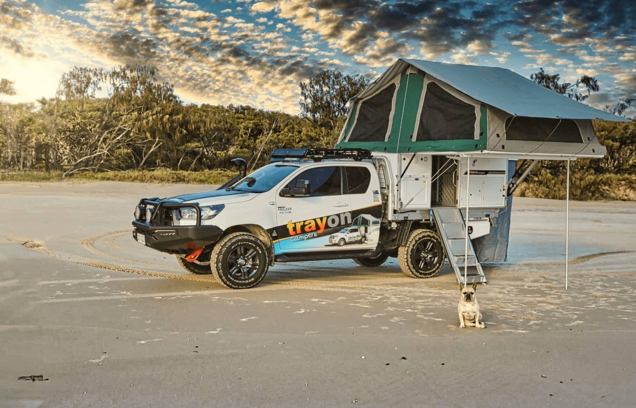Toyota Hilux with Trayon Camper and French Bull Dog on Beach
